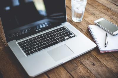 Laptop computer and phone on desk